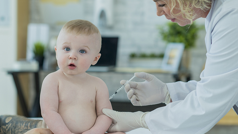 toddler getting a vaccine