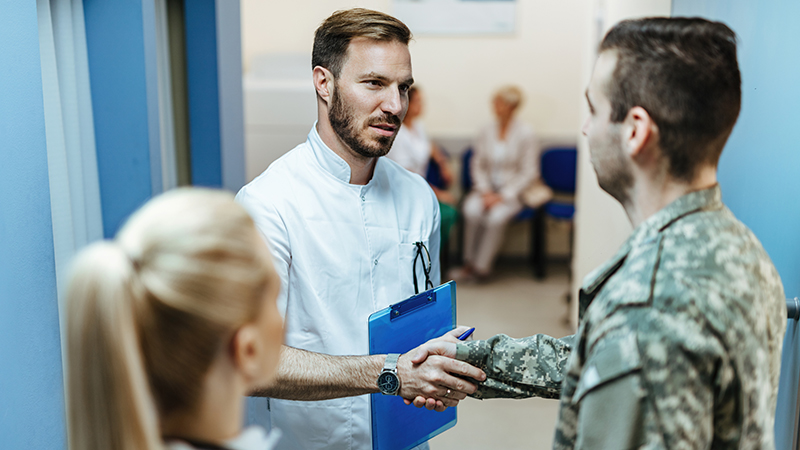 doctor and soldier shaking hands