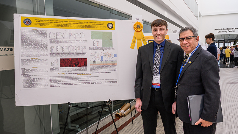 Richard J. Barohn, MD, Executive Vice Chancellor for Health Affairs and Hugh E. and Sarah D. Stephenson Dean attends the afternoon poster session during the 2022 Health Sciences Research Day. Jacob Russell was awarded the MU School of Medicine Dean’s Award. 