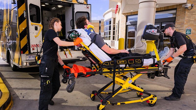 patient on gurney at an ambulance