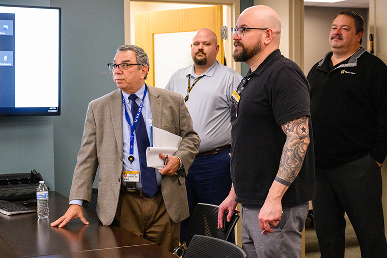 I am seen here viewing security footage with Chris Stackhouse, director; Aaron Brame, security technical specialist.