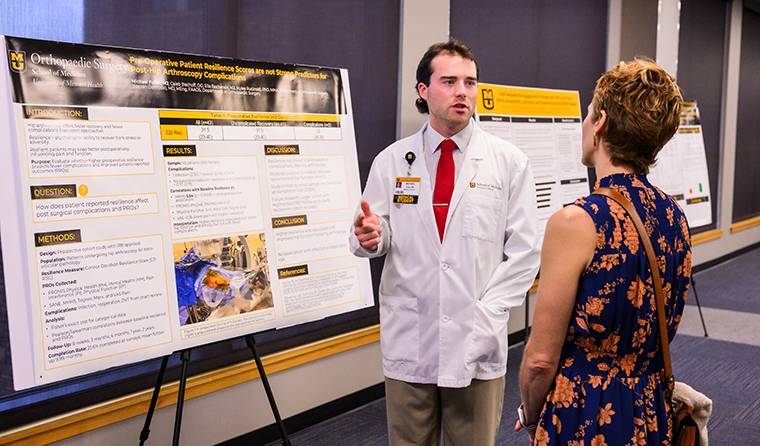 Michael Fuller gives a poster presentation.