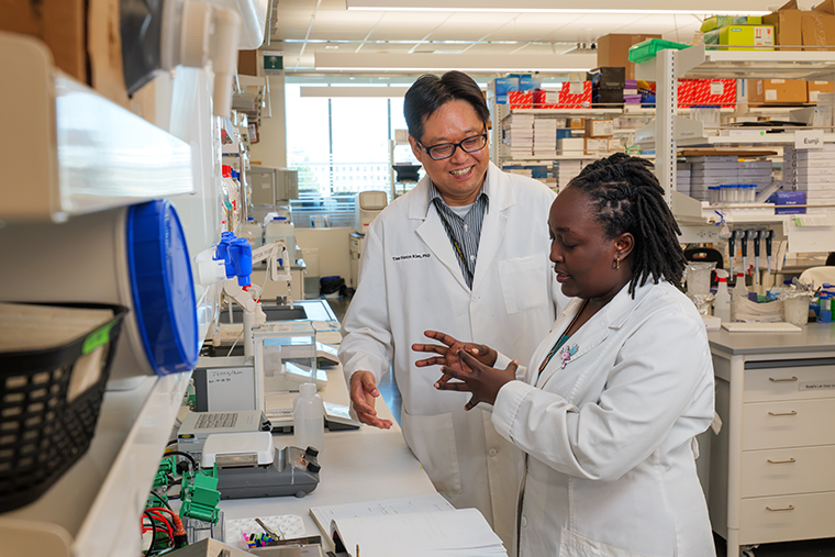  Dr. Tae Hoon Kim and Harriet Omenge.
