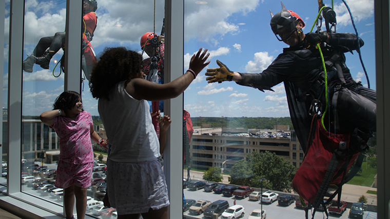 A Columbia firefighter rappels down the front of Children’s Hospital