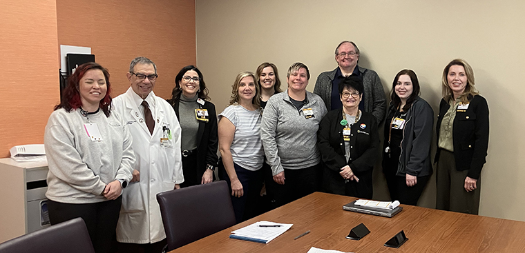 Dr. Barohn poses with the MUPC Tier 1 huddle team.