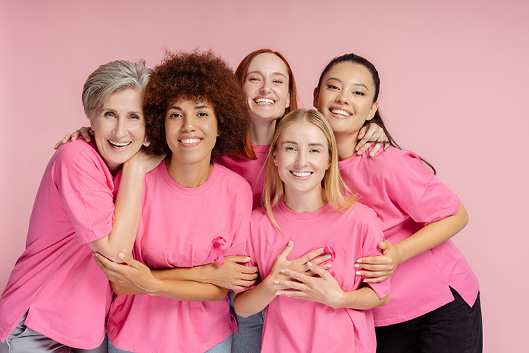 group of women wearing pink