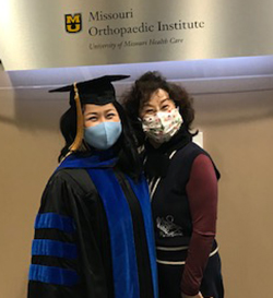 Dr. Naomi Lee with her mother at her hooding ceremony.
