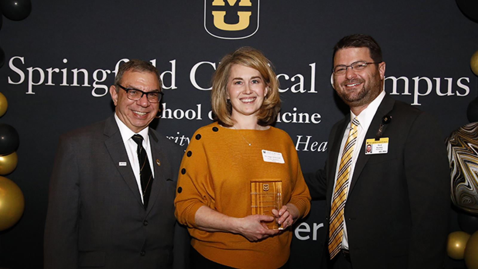 Lecturer of the Year is presented to Dr. Angela Whitesell.