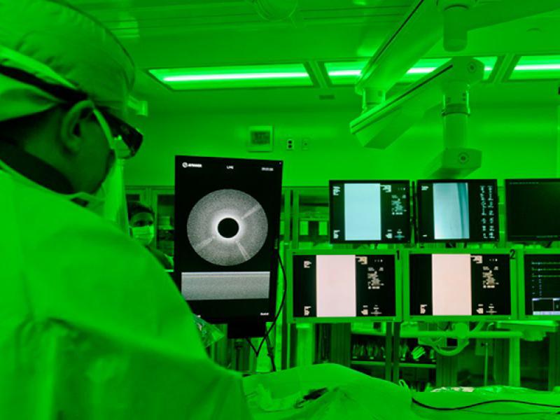 Todd Vogel, MD, performs a procedure using the Ocelot device in the hybrid operating room at University Hospital