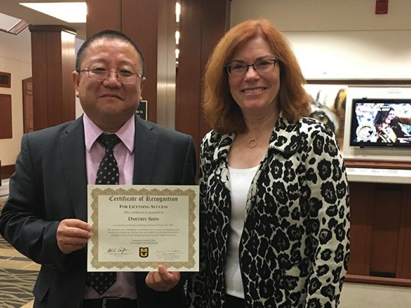 Dmitriy Shin, left, poses with former MU Provost Garnett Stokes.
