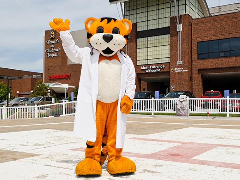 TJ waving on helipad