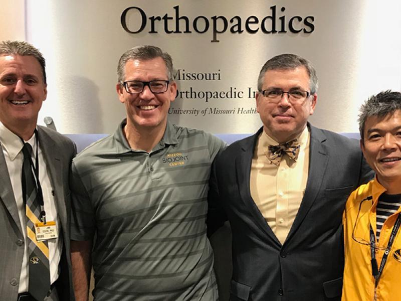 From left, James Cook, PhD, DVM; Aaron Stoker, PhD; Keith Kenter, MD; and Kei Kuroki, PhD, DVM, recently gathered at the Thompson Laboratory for Regenerative Orthopaedics. Kenter received his doctorate from the University of Missouri and helped Cook start the Comparative Orthopaedic Lab at MU almost 20 years ago.