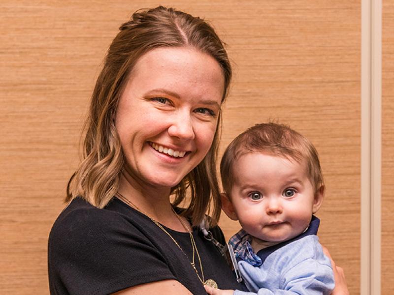 Melanie Pancoast holds infant, Memphis Hall.