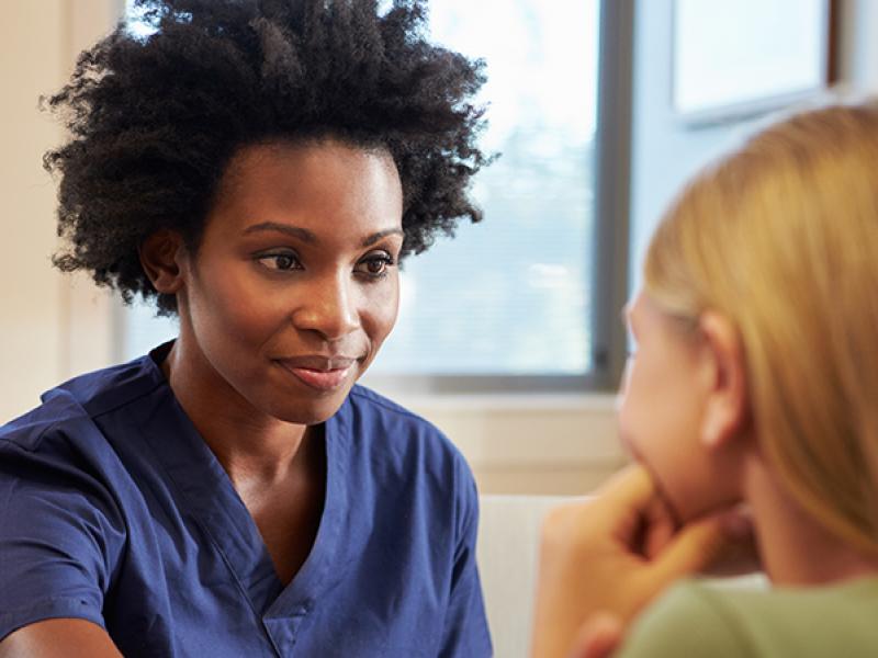 female doctor with young patient