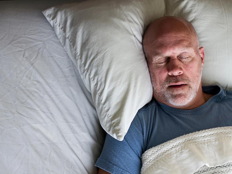 male sleeping in bed