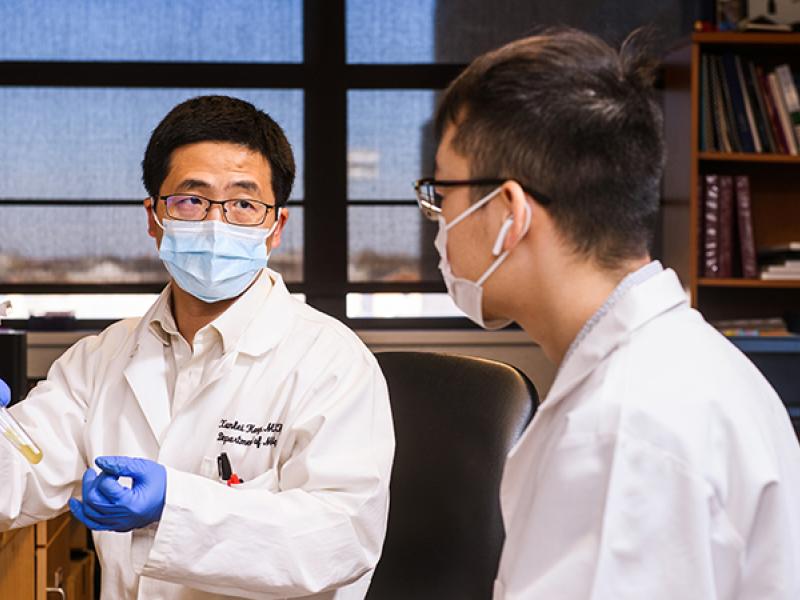 Xunlei Kang, MD, PhD in his lab