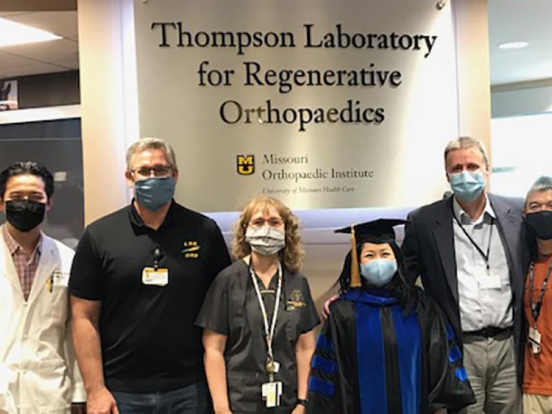 Dr. Naomi Lee with her PhD doctoral committee at her hooding ceremony.