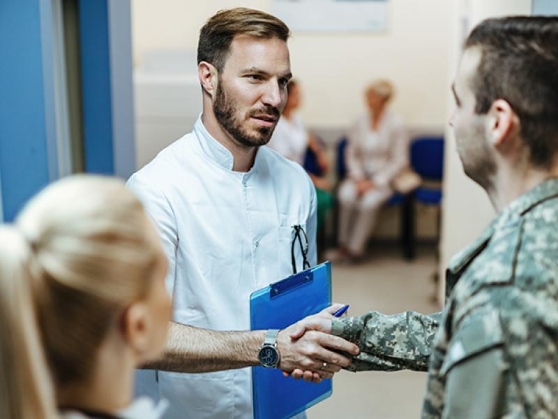 doctor and soldier shaking hands