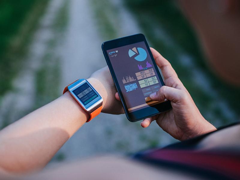 woman synchronizing smartwatch