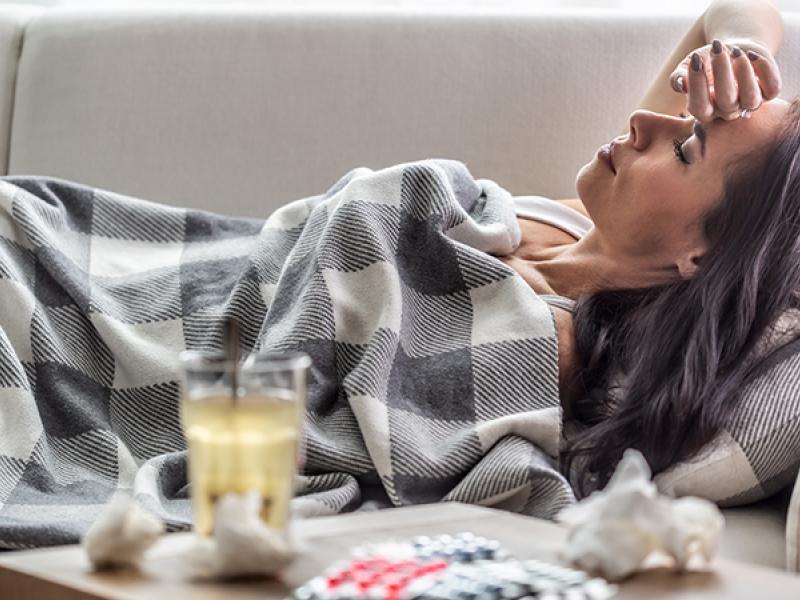 sick female on a couch