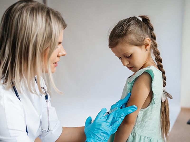 young girl getting injection