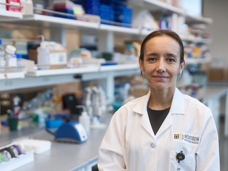 A photo of Dr. Camila Manrique-Acevedo in a lab.