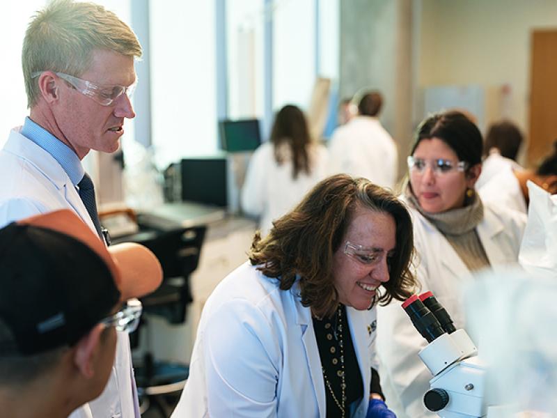 NextGen Precision Health doctors in a lab